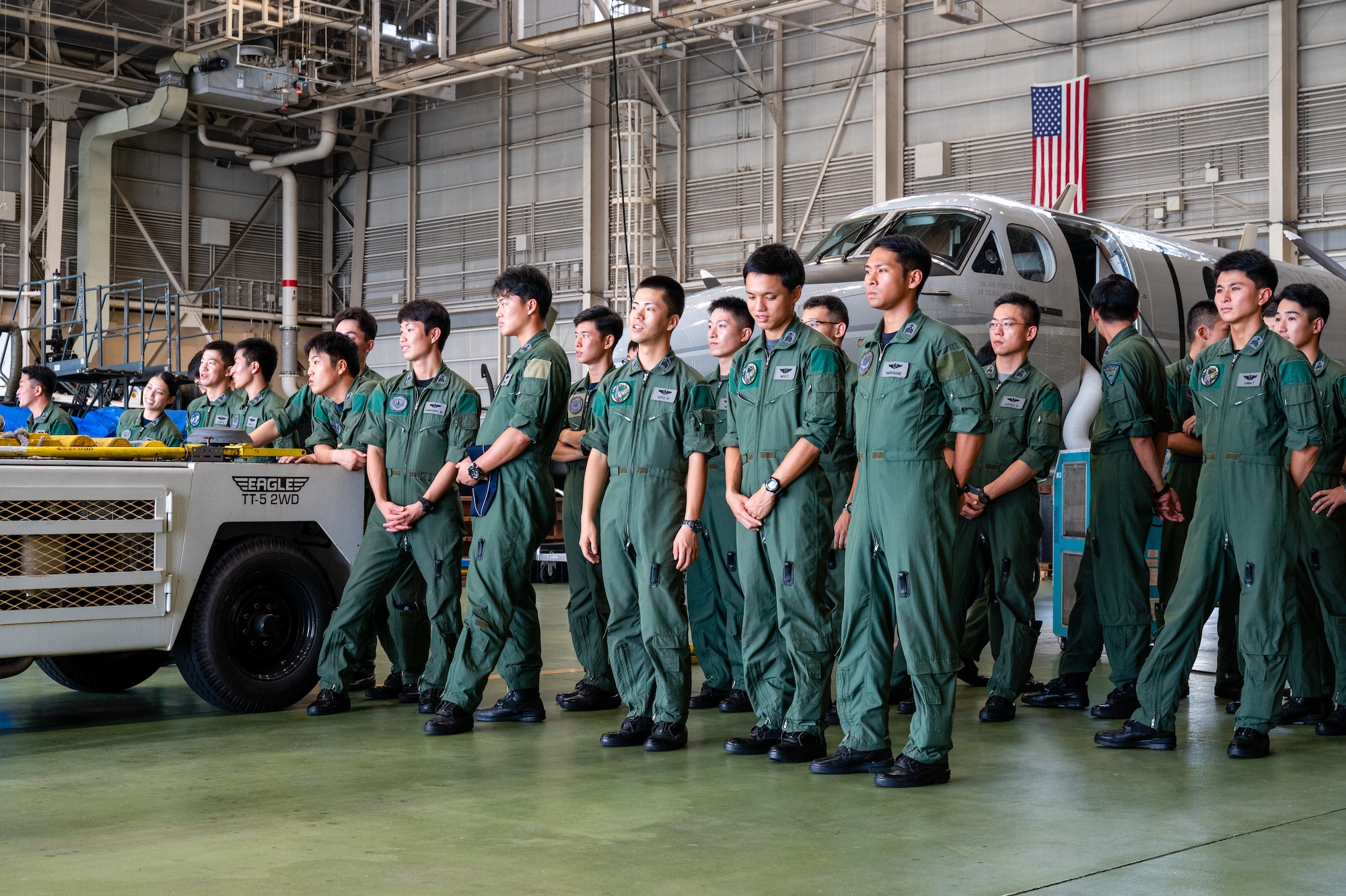 Japan Air Self-Defense Force Officer Candidate School students look at a UH-1N Huey assigned to the 459th Airlift Squadron during a tour at Yokota Air Base, Japan.