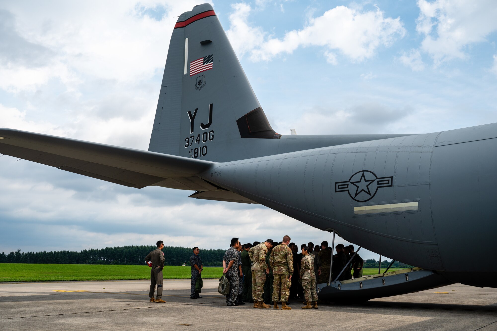 Japan Air Self-Defense Force Officer Candidate School students view a C-130J Super Hercules assigned to the 36th Airlift Squadron during a tour at Yokota Air Base, Japan.