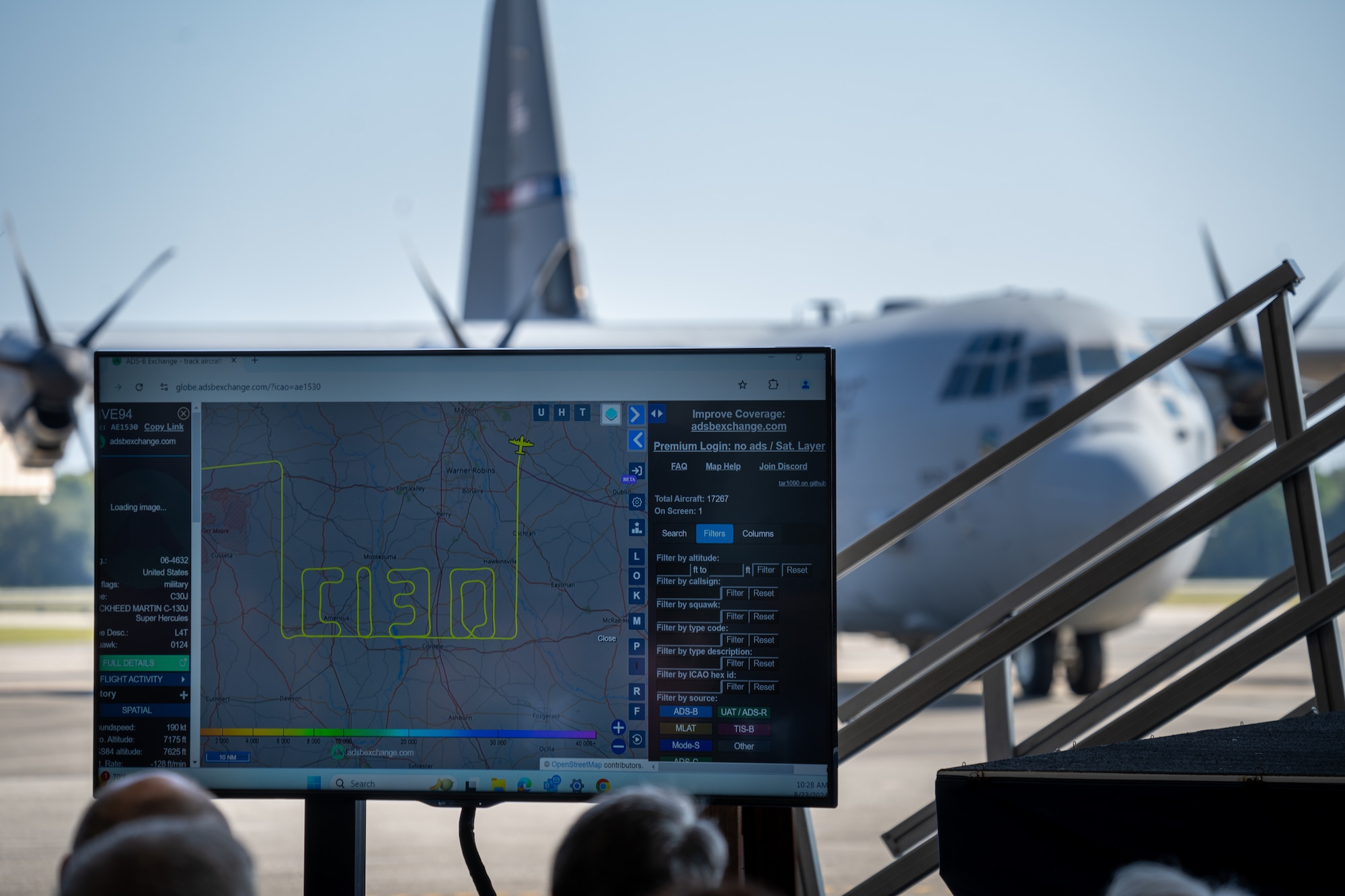 A screen displays a flight path spelling out C-130