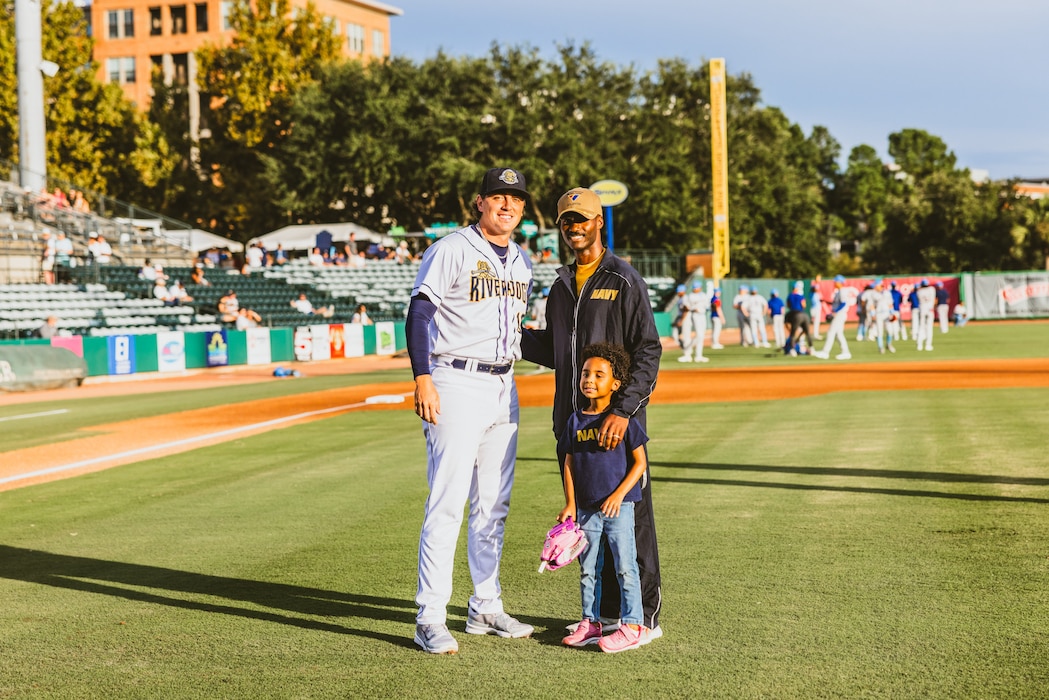 "NIWC Atlantic's new Commanding Officer CAPT Matt O'Neal recently threw out the first pitch at the Charleston RiverDogs Military Appreciation game on Aug. 22. This was the RiverDogs third appreciation game of the season" honoring active-duty service members, Veterans and their families. O'Neal, who assumed command of NIWC Atlantic last month, was recognized from the field as a local military leader. Go Dogs! (Photo by Emma Bair, Charleston RiverDogs Creative Media Intern