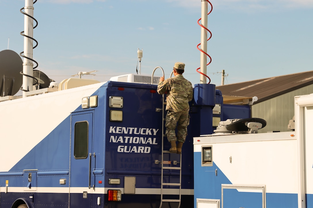 Preparations are being made to the Kentucky National Guard's Mobile Command Unit prior to the road show event. Soldiers from the Kentucky Army National Guard’s Communication/Information Technology Mission Command mobilized through parts of western Kentucky August 12-16 for a natural disaster response exercise alongside local emergency management officials. (U.S. Army National Guard Photo by Milt Spalding)