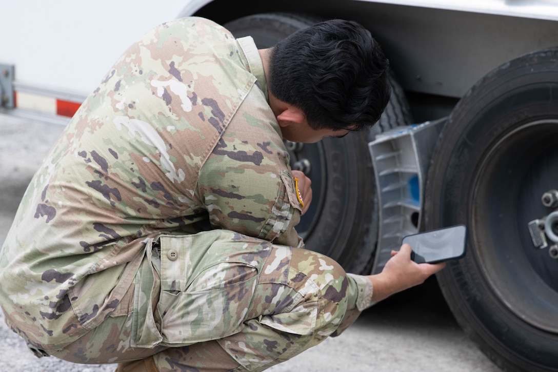 Sgt. John Kutz performs checks on the Mobile Command Trailer during a mission in western Kentucky. Soldiers from the Kentucky Army National Guard’s Communication/Information Technology Mission Command mobilized through parts of western Kentucky August 12-16 for a natural disaster response exercise. (U.S. Army National Guard Photo by Milt Spalding)