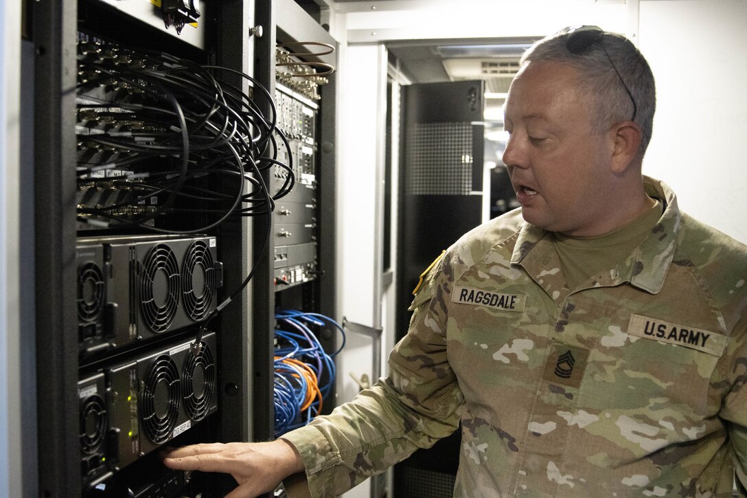 Master Sgt. Clinton Ragsdale inspects radio equipment in the Mobile Command Unit. Soldiers from the Kentucky Army National Guard’s Communication/Information Technology Mission Command mobilized through parts of western Kentucky August 12-16 for a natural disaster response exercise.