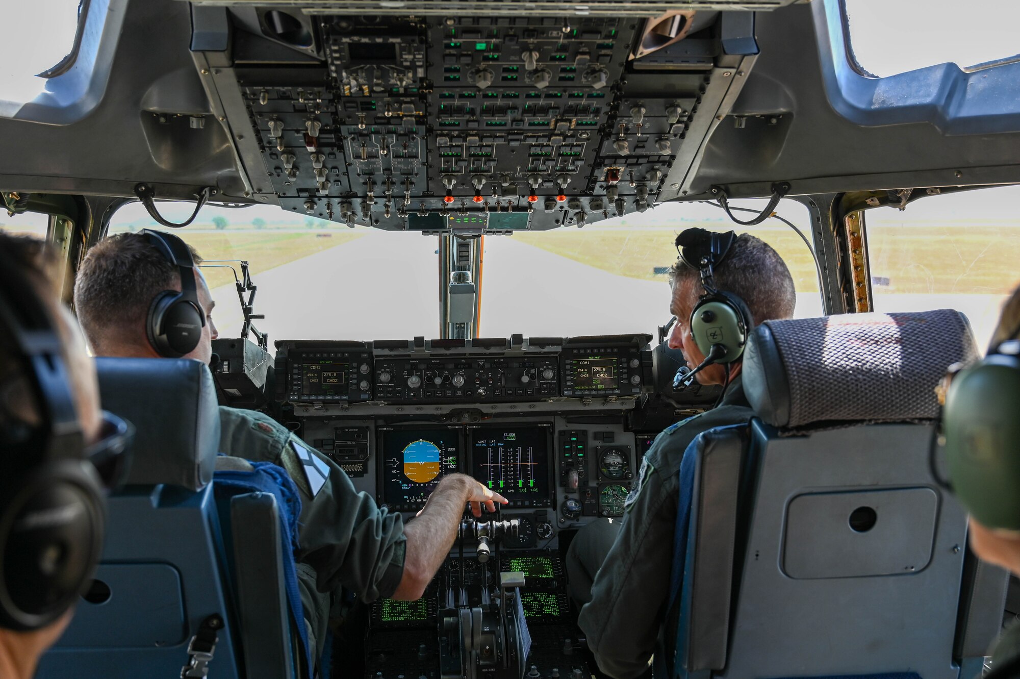 U.S. Air Force Maj. Johnathan Crawley, 97th Air Mobility Wing chief executive officer, and Maj. Gen. Gregory Kreuder, 19th Air Force (AF) commander, land a C-17 Globemaster III aircraft at Altus Air Force Base, Oklahoma, Aug. 23, 2024. On the flight, the 19th AF command team observed an airdrop and an assault landing exercise. (U.S. Air Force photo by Airman 1st Class Heidi Bucins)