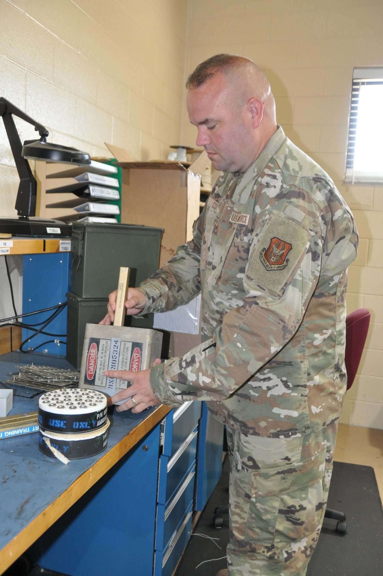 a man works on ammo