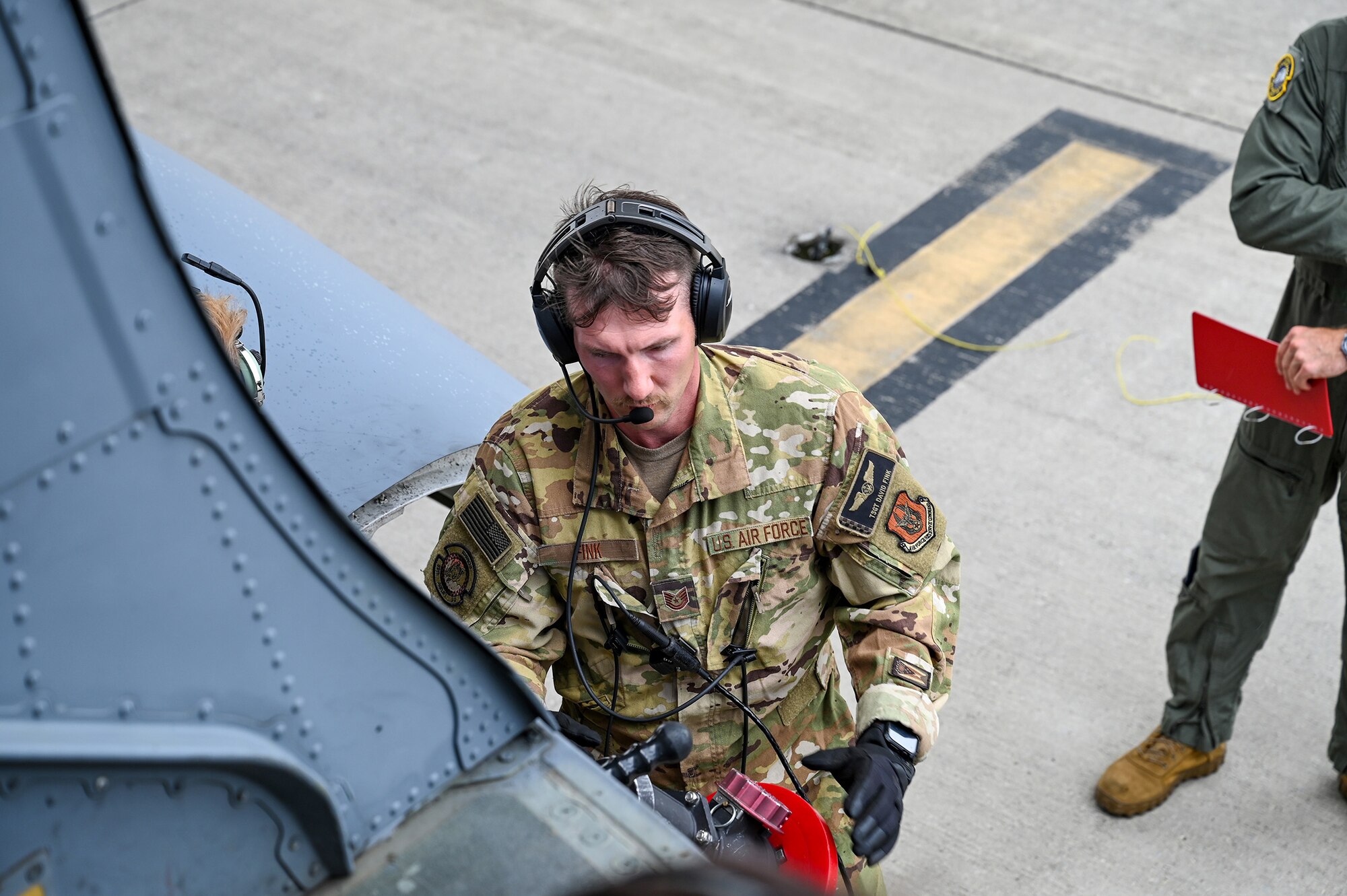 Tech. Sgt. David Fink, 89th Airlift Squadron loadmaster, hooks up a fuel hose to a C-17 Globemaster III during specialized fueling operations at Wright-Patterson Air Force Base, Ohio, Aug. 3, 2024. SFO training includes hot refueling, wet-wing defueling, and bulk fuel delivery systems, all which Airmen are evaluated on utilizing proper checklists. (U.S. Air Force photo/Tech. Sgt. Joel McCullough)
