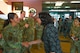 Under Secretary of the Air Force Melissa Dalton coins U.S. Air Force Master Sgt. Sarah Bordges, 5th Security Forces Squadron first sergeant, during a visit to Minot Air Force Base, North Dakota, Aug. 27, 2024. Dalton visited Minot AFB to gain insight into nuclear modernization and meet with Team Minot Airmen.