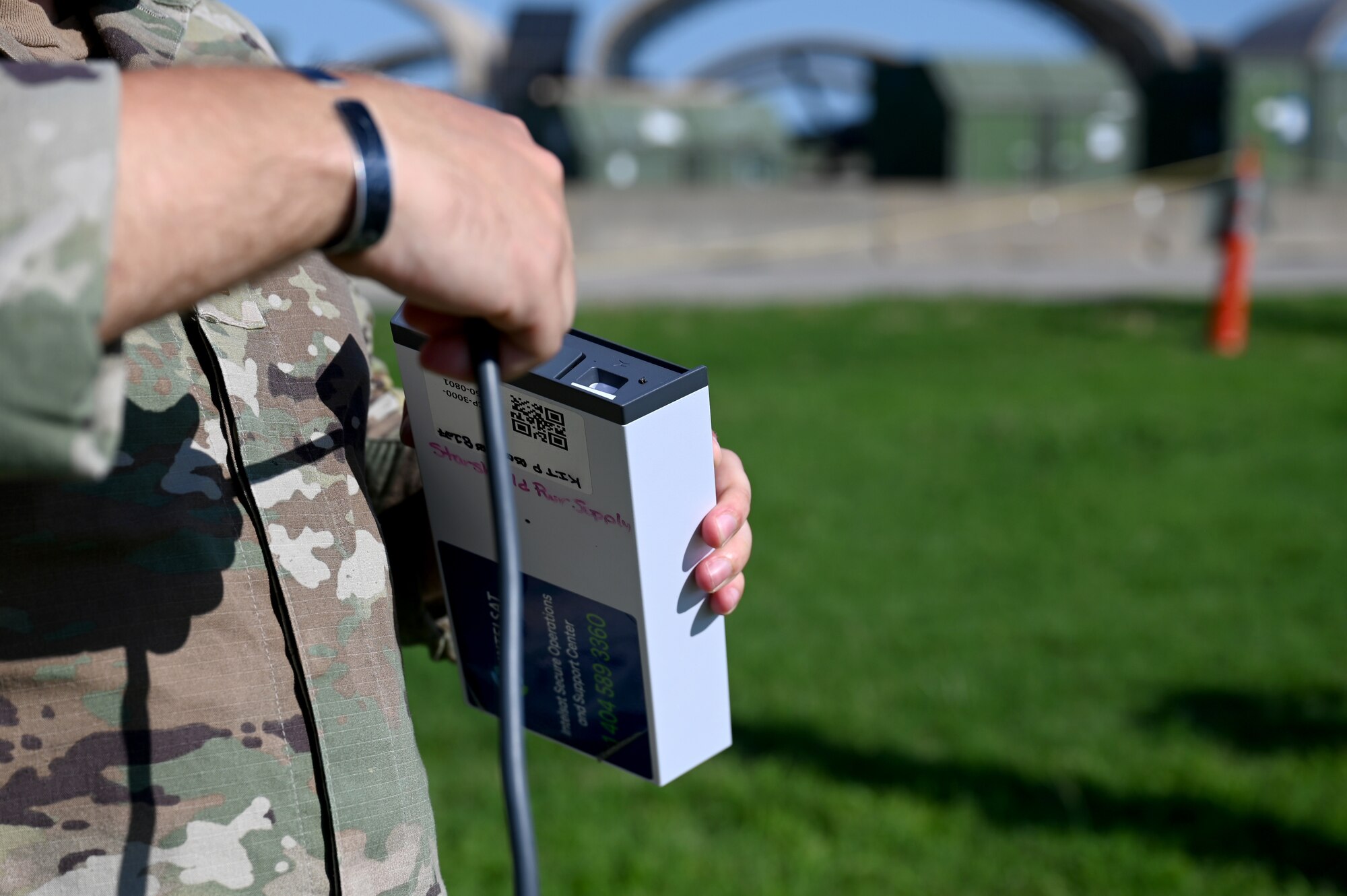 A U.S. Airman assigned to the 20th Operations Support Squadron connects a satellite to its power supply during a demonstration of the fourth iteration Deployed Intelligence Combat Element kit at Joint Base Langley-Eustis, Virginia, Aug. 22, 2024. The DICE-4 kit is intended to be fast, portable and durable, allowing intelligence analysts to establish a secure connection from anywhere in the world. (U.S. Air Force photo by Staff Sgt. Kelsey Owen)