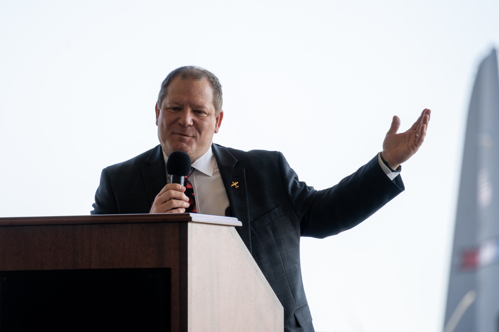 Mike Beasley speaks behind a podium