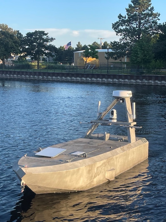 An Unmanned Surface Vessel floats in a body of water.