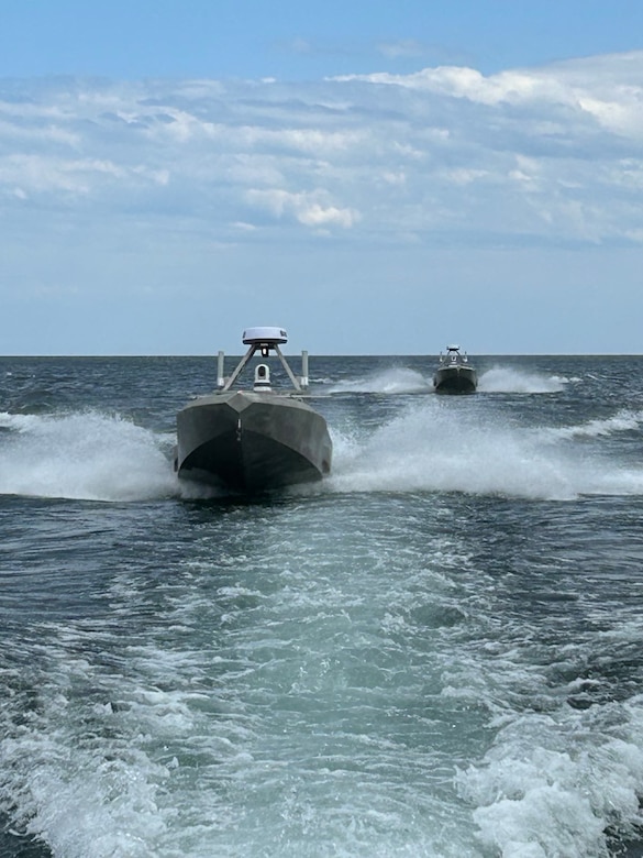 Twin Unmanned Surface Vessels  drive in a open body of water.