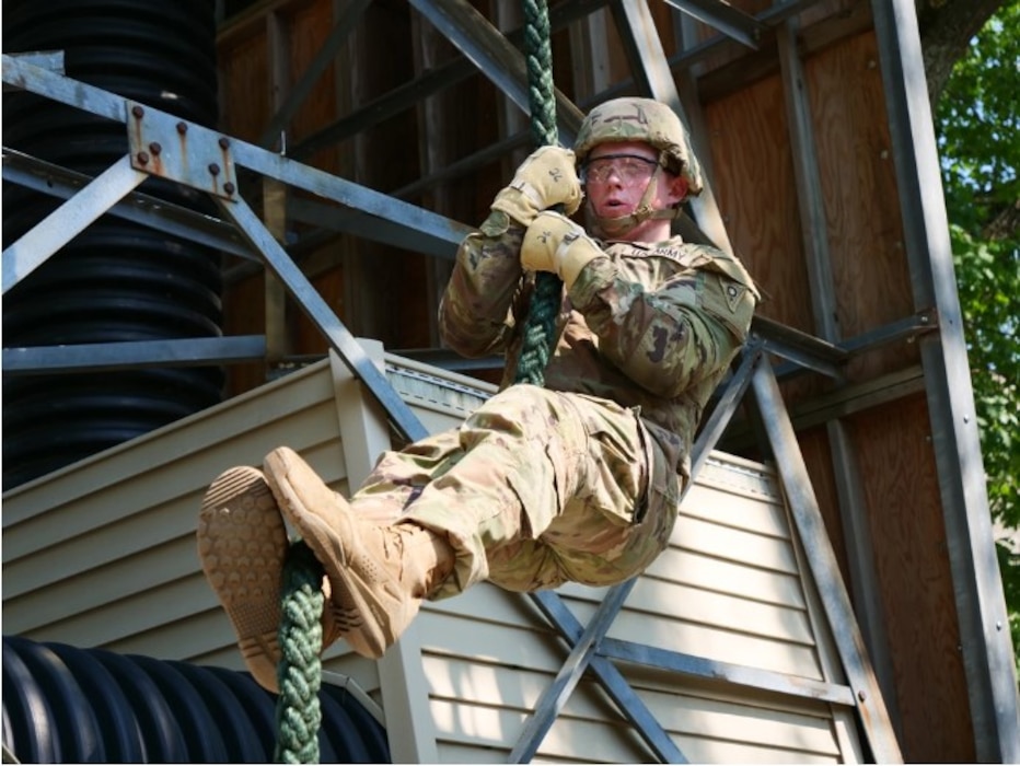 Soldier repels down rope