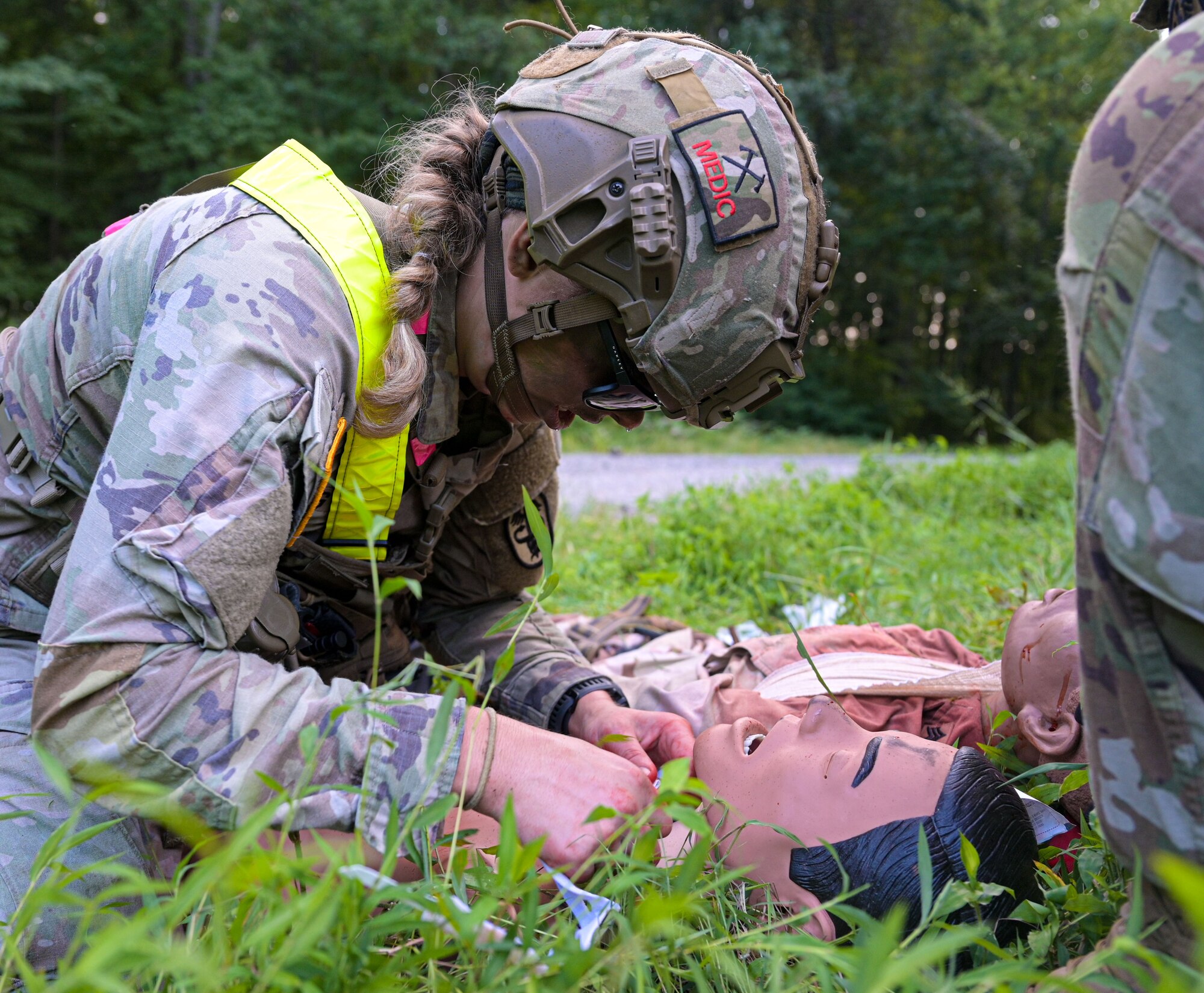 Soldier aiding simulated patient