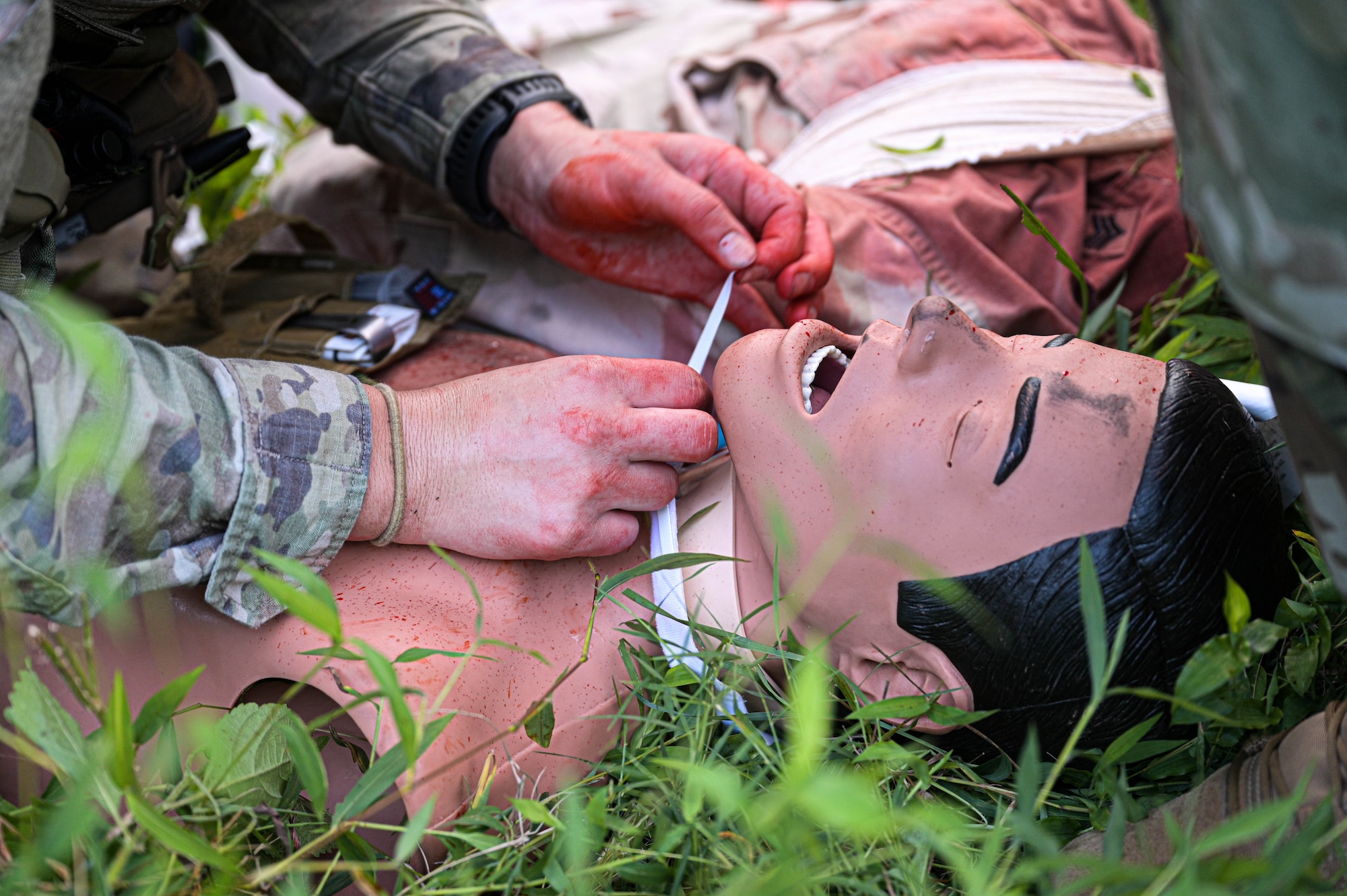 Soldier giving care to simulated patient