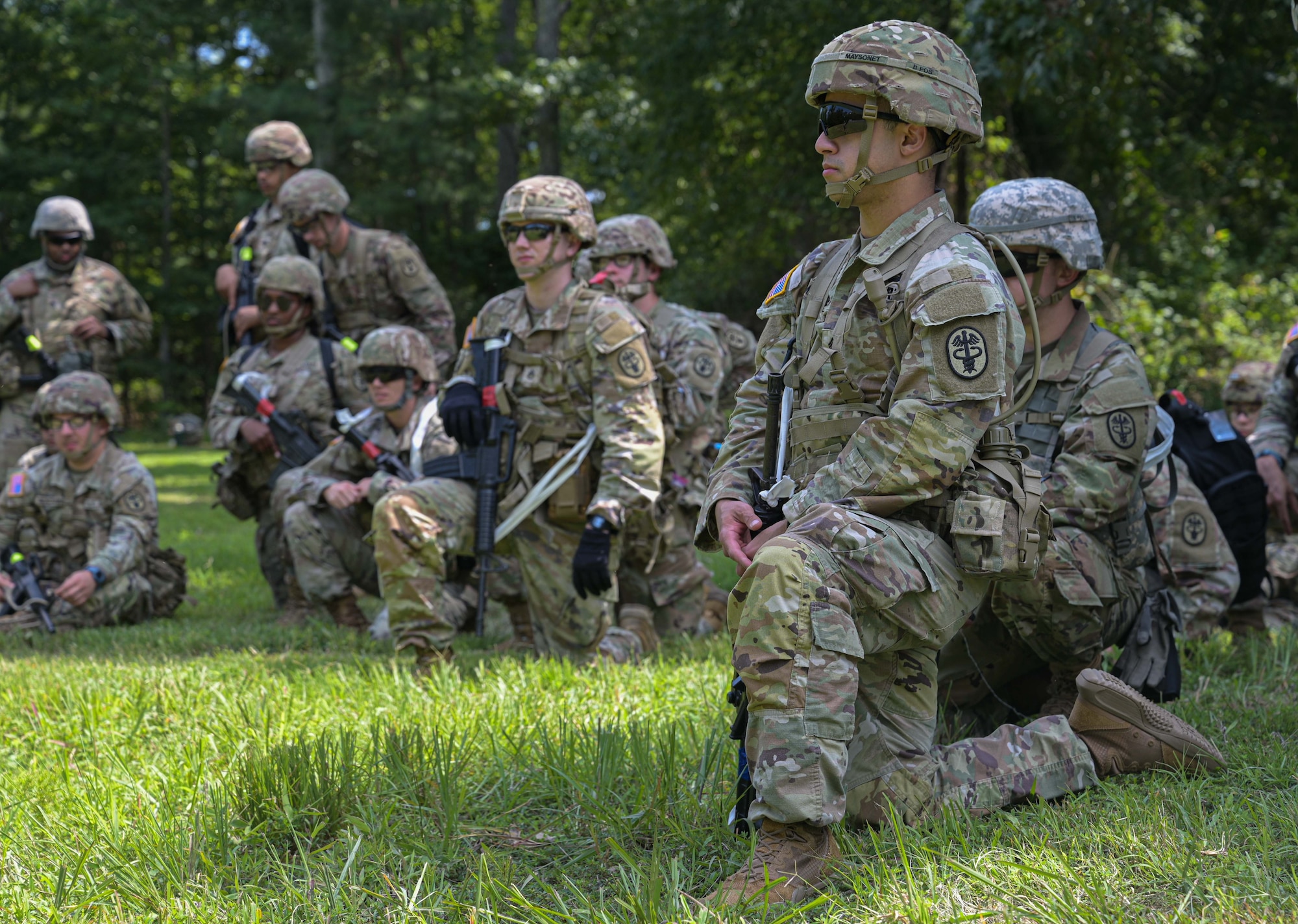 Soldier kneels on the ground