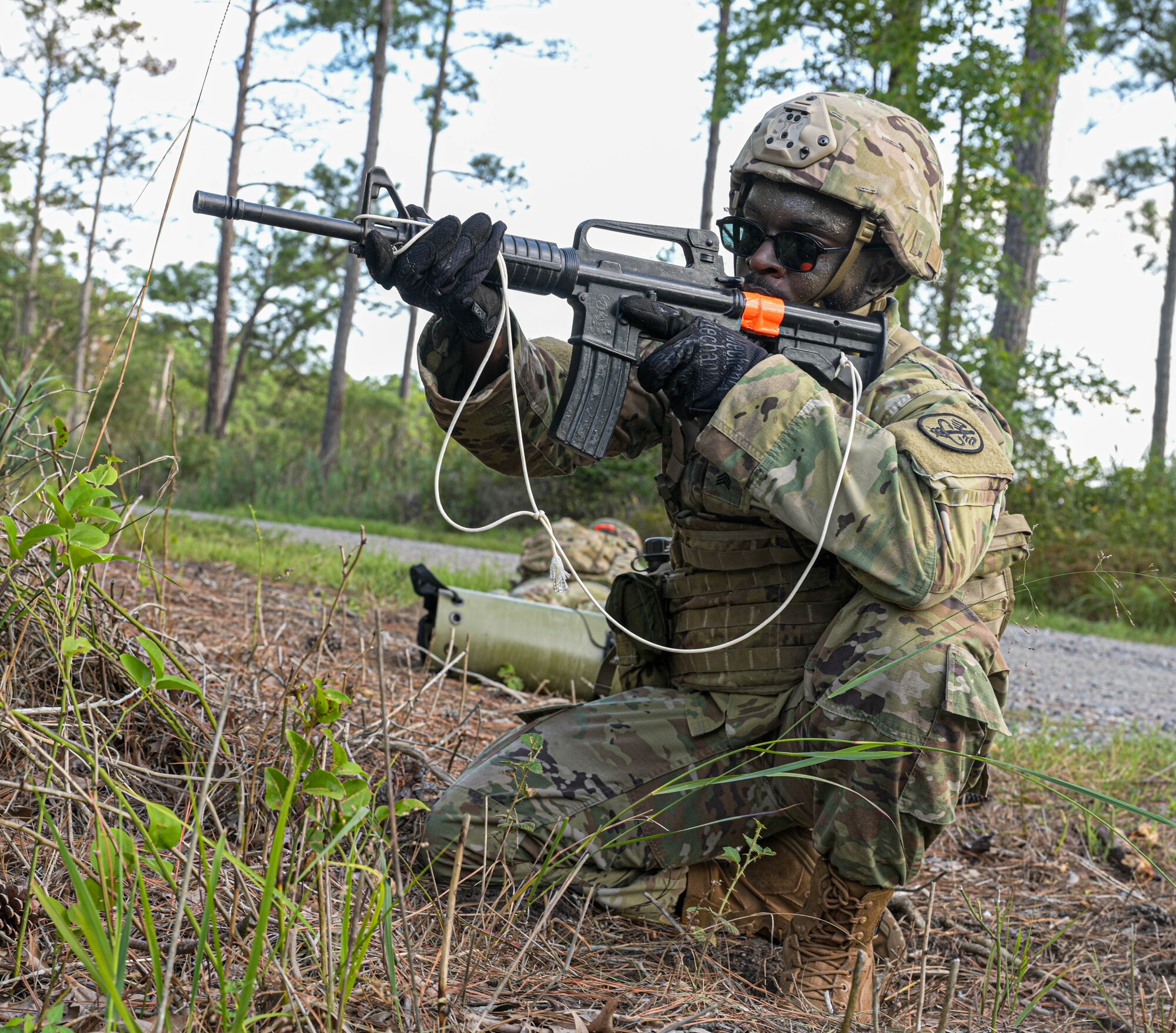 Soldier carrying fake gun.