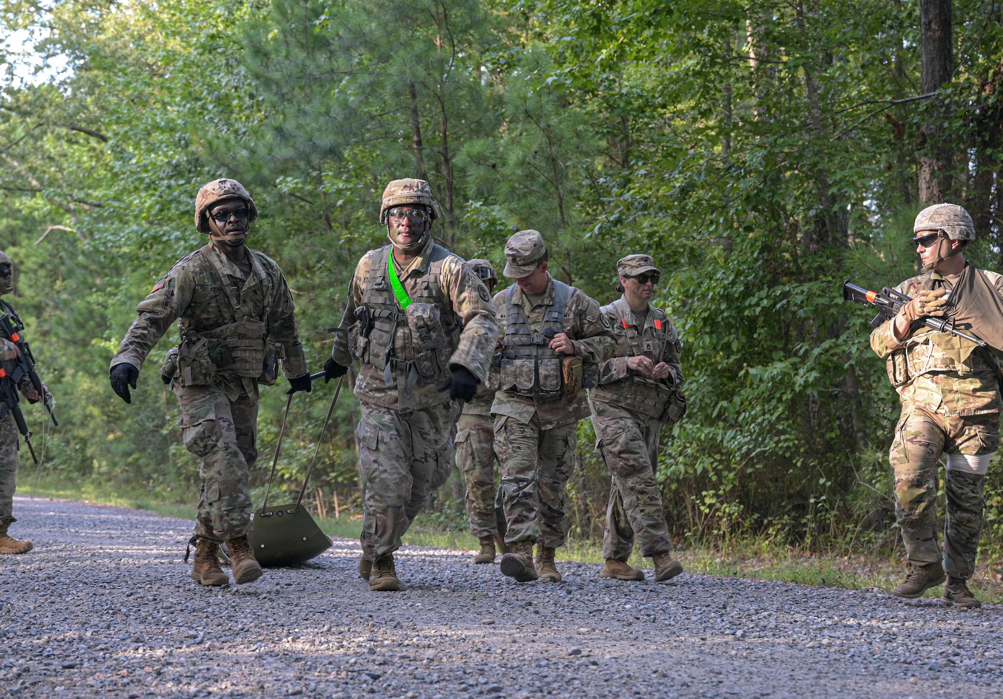 Soldiers dragging gurney