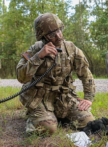 A U.S. Army Soldier with the McDonald Army Health Center transmits a 9-line medical evacuation request for a simulated casualty during a field training exercise at Joint Base Langley-Eustis, Virginia, Aug. 21, 2024. Performing a 9-lines standardize the process of requesting medical evacuations, ensuring essential information is communicated quickly to facilitate timely and effective care for the injured. (U.S. Air Force photo by Airman 1st Class Adisen Smith)
