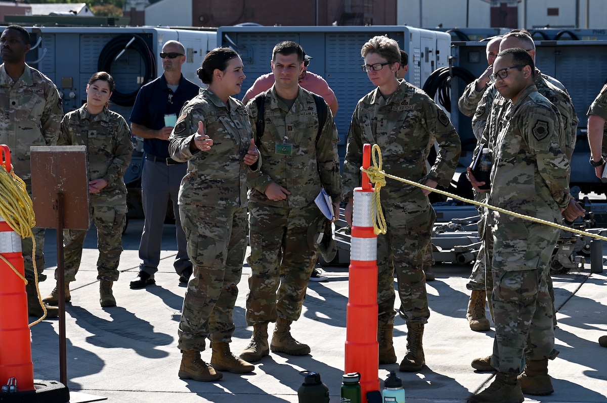 U.S. Air Force Lt. Gen. Leah Lauderback, Intelligence, Surveillance, Reconnaissance and Cyber Effects Operations deputy chief of staff, second from right, listens to an explanation of processes and applications of the the fourth iteration Deployed Intelligence Combat Element kit during a demonstration by the 1st and 20th Operations Support Squadrons at Joint Base Langley-Eustis, Virginia, Aug. 22, 2024. The DICE-4 kit allows intelligence analysts to rapidly deploy to any location with the capability of setting up a Sensitive Compartmented Information Facility in minutes. (U.S. Air Force photo by Staff Sgt. Kelsey Owen)
