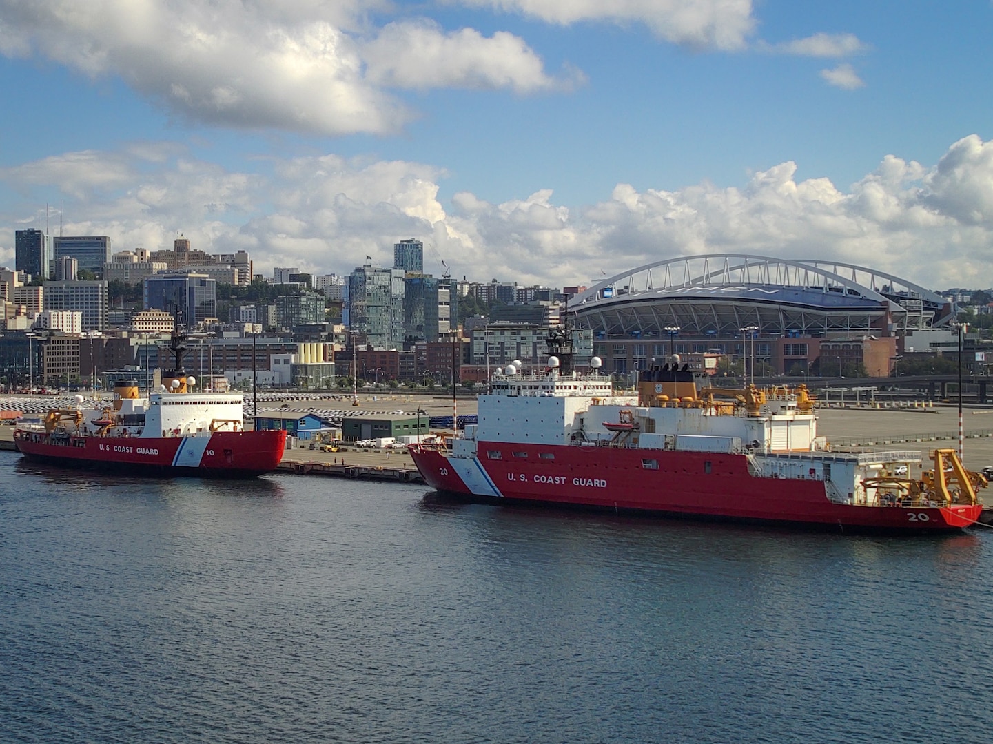 U.S. Coast Guard Cutter Polar Star (WAGB 10) (left) sits moored next to U.S. Coast Guard Cutter Healy (WAGB 20) at Coast Guard Base Seattle, Aug. 25, 2024. The Polar Star and Healy are routinely deployed to Arctic and Antarctic locations to support science research or help resupply remote stations. (U.S. Coast Guard photo by Lt. Chris Butters)