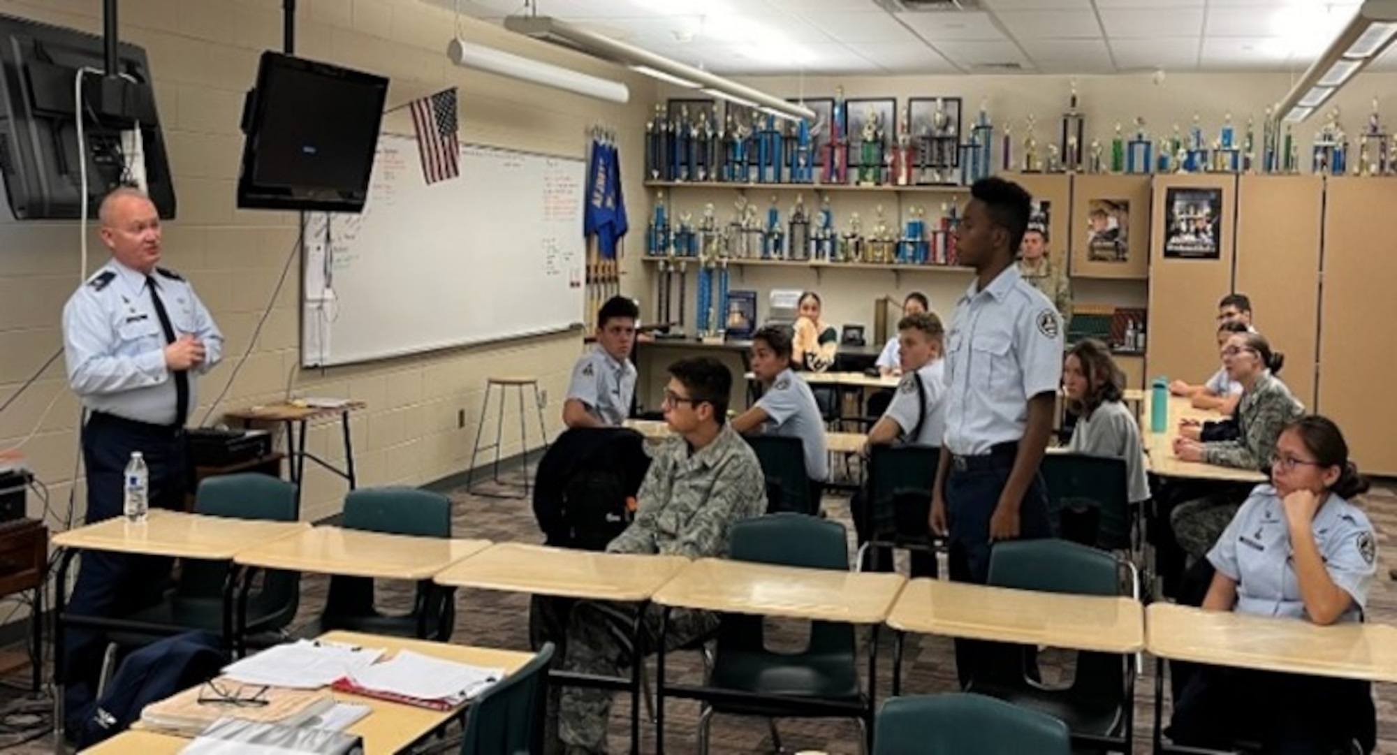 Air force officer speaks to students in classroom