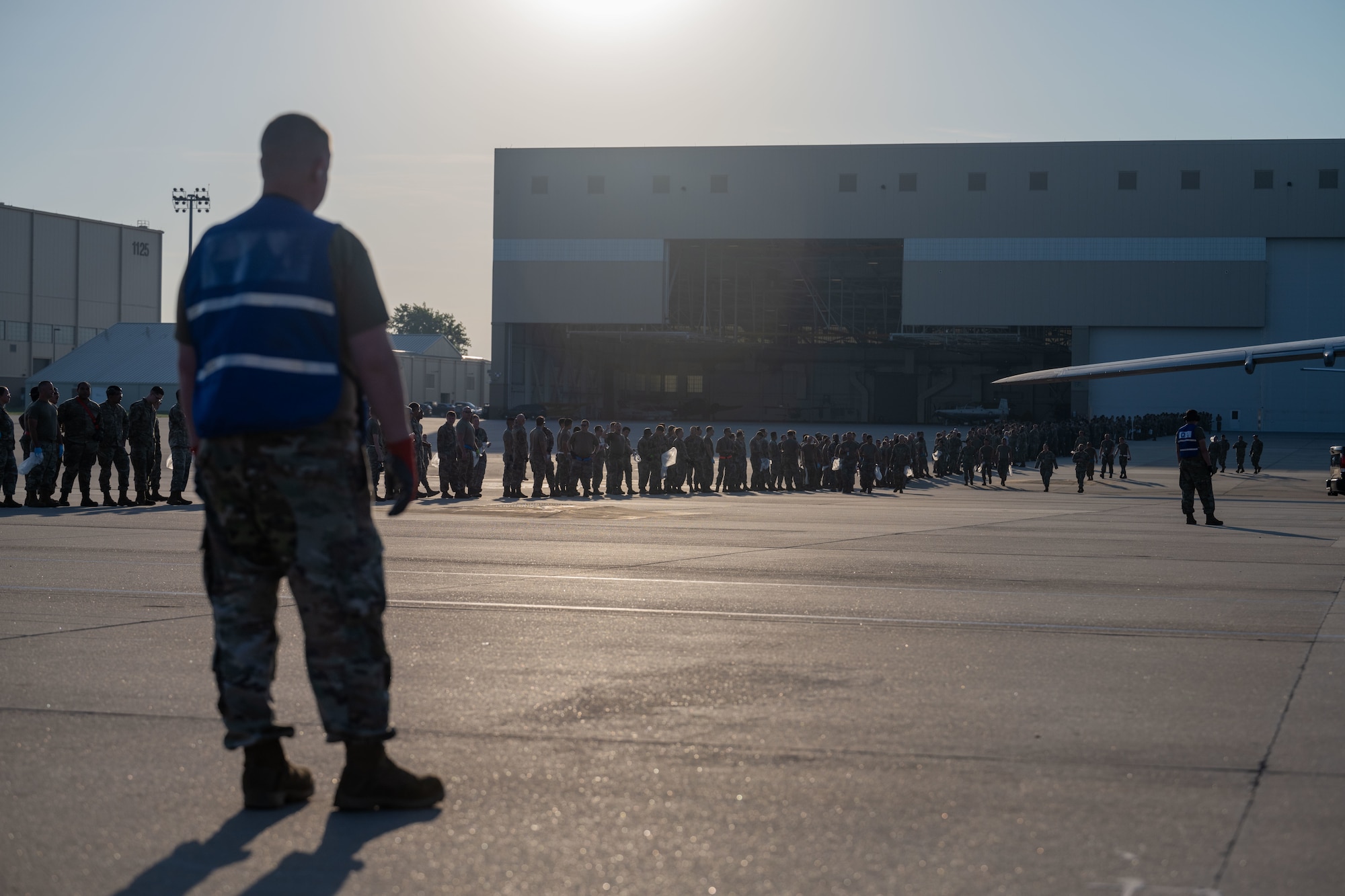Team McConnell Airmen conduct a foreign object debris (FOD) walk following the Frontiers in Flight Air Show Aug. 26, 2024, at McConnell Air Force Base, Kansas. FOD included materials such as rocks, loose hardware, and litter from the air show. (U.S. Air Force photo by Airman 1st Class Paula Arce)