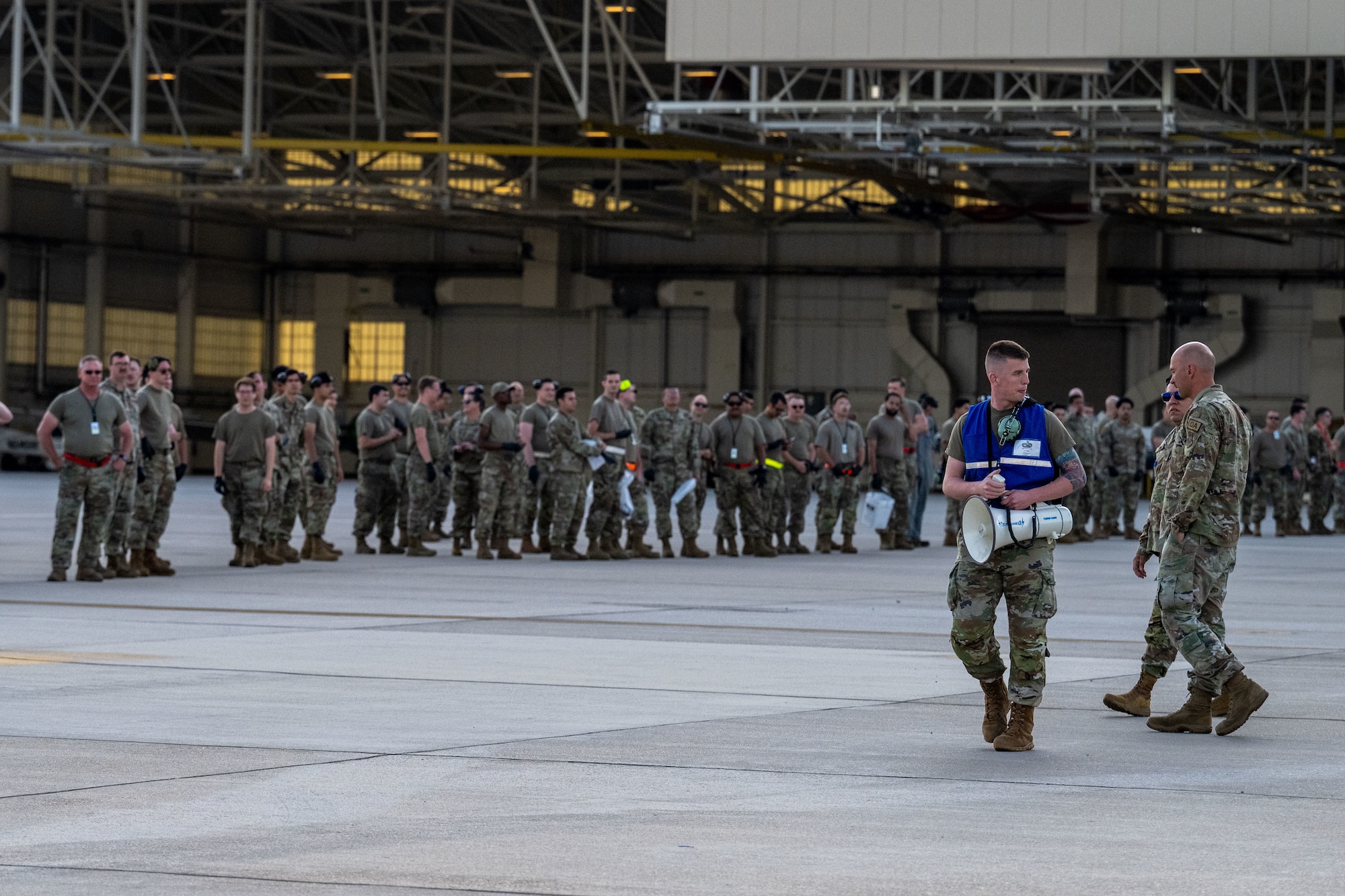 Team McConnell Airmen conduct a foreign object debris (FOD) walk following the Frontiers in Flight Air Show Aug. 26, 2024, at McConnell Air Force Base, Kansas. FOD included materials such as rocks, loose hardware, and litter from the air show. (U.S. Air Force photo by Airman 1st Class Paula Arce)