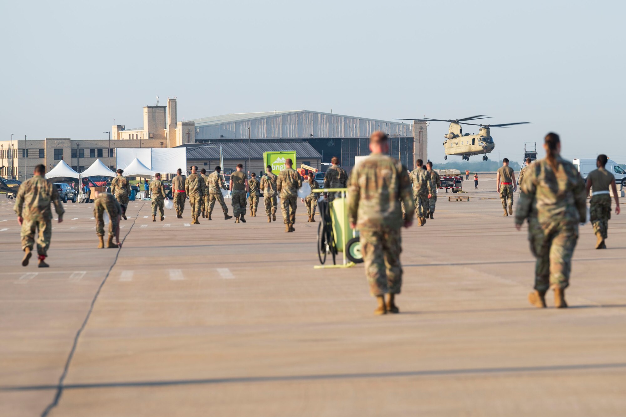 Airmen assigned to the 22nd Air Refueling Wing conduct a foreign object debris (FOD) walk following the Frontiers in Flight Air Show Aug. 26, 2024, at McConnell Air Force Base, Kansas. The FOD walk included Airmen from every group in the wing to clear the flightline of materials such as rocks, loose hardware and litter from the air show. (U.S. Air Force photo by Airman 1st Class Gavin Hameed)