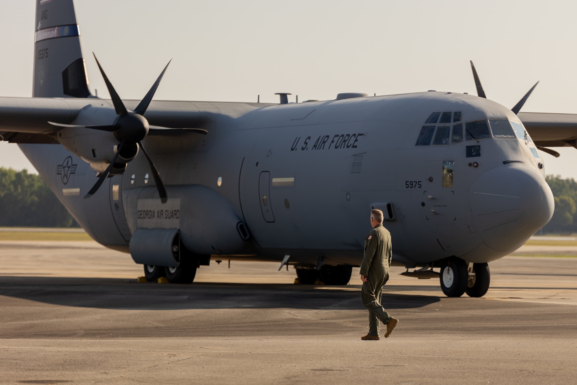 Gen. Mike Minihan walks by a C-130J Super Hercules Aug. 23, 2024 at Robins Air Force Base, Georgia. Minihan, Air Mobility Command commander, celebrated the 70th anniversary of the C-130 aircraft along with other Air Force and Lockheed Martin leaders. (U.S. Air Force photo by Chris Bishop)