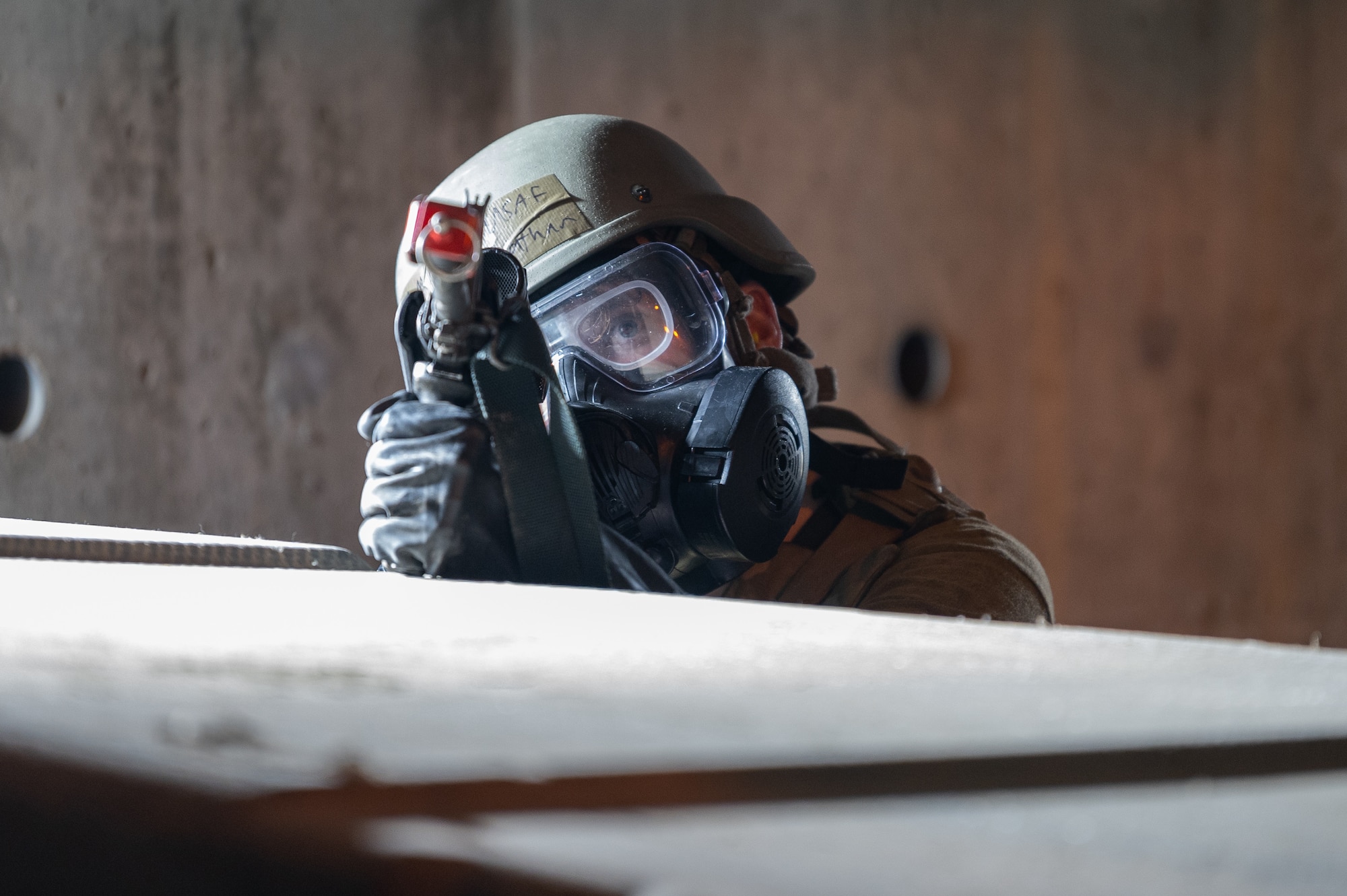 A U.S. Air Force Airman assigned to the 51st Fighter Wing provides cover to their team amid a simulated attack during Ulchi Freedom Shield 24 at Osan Air Base, Republic of Korea, Aug. 23, 2024. Routine training is essential for 51st FW Airmen to refine their warfighting proficiencies through practical application, concurrently enhancing their ability to respond skillfully to contingencies. UFS24 is an annual combined exercise conducted in support of the U.S.-ROK Mutual Defense Treaty that highlights the U.S.’s commitment to the alliance. (U.S. Air Force photo by Staff Sgt. Ashley N. Mikaio)