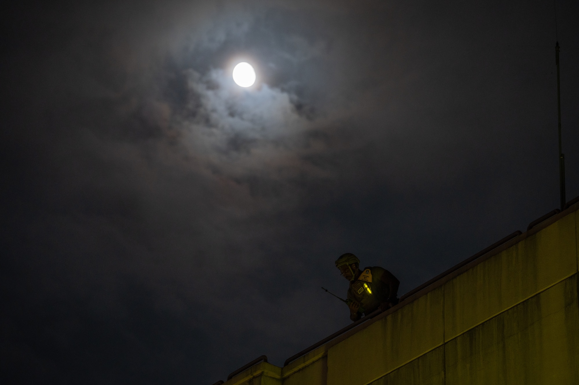 A U.S. Air Force wing inspection team member assigned to the 51st Security Forces Squadron observes a simulated attack during Ulchi Freedom Shield 24 at Osan Air Base, Republic of Korea, Aug. 22, 2024. Training is conducted throughout the year to generate combat airpower at a moment’s notice, affirming the U.S. ironclad commitment to the ROK and ensuring regional stability throughout the U.S. Indo-Pacific Command. UFS24 is an annual combined exercise conducted in support of the U.S.-ROK Mutual Defense Treaty that highlights the U.S.’s commitment to the alliance. (U.S. Air Force photo by Staff Sgt. Ashley N. Mikaio)