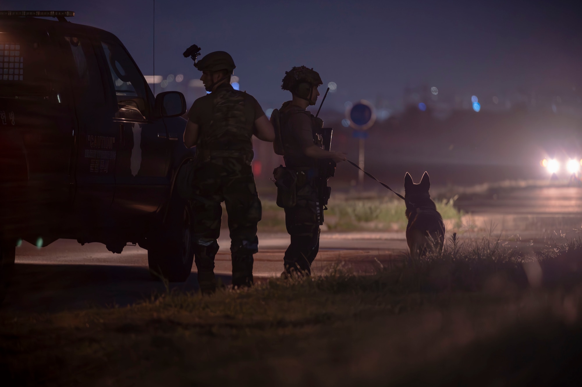 U.S. Air Force military working dog handlers assigned to the 51st Security Forces Squadron respond to a simulated hostile force with their MWD companions, during Ulchi Freedom Shield 24, at Osan Air Base, Republic of Korea, Aug. 22, 2024. MWD handlers operate slightly differently than conventional security forces patrolmen, they provide critical support in ensuring the security and protection of the installation and its assets. UFS 24 is an annual combined exercise conducted in support of the U.S.-ROK Mutual Defense Treaty that highlights the U.S. commitment to the alliance. (U.S. Air Force photo by Senior Airman Sabrina Fuller-Judd)