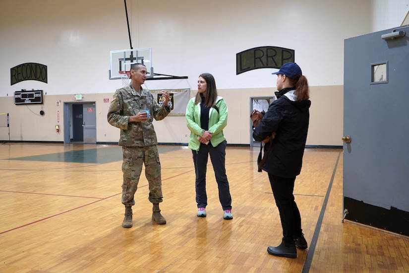 Alaska Army National Guard Staff Sgt. Omar Matos, the Ketchikan armory attendant, confers with members of the Alaska Division of Homeland Security and Emergency Management Aug. 28, 2024, following a major landslide in Ketchikan, Alaska, two days earlier. Four Alaska Army National Guardsmen and two members of the Alaska State Defense Force mobilized on State Active Duty to assist with response and recovery efforts.