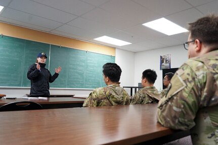 Ms. Lanita Copeland, the State Emergency Operations Center Division Supervisor in Ketchikan, briefs Alaska Army National Guardsmen being mobilized to respond to a major landslide in Ketchikan, Alaska, Aug. 28, 2024. Four Alaska Army National Guardsmen and two members of the Alaska State Defense Force mobilized on State Active Duty to assist with response and recovery efforts.