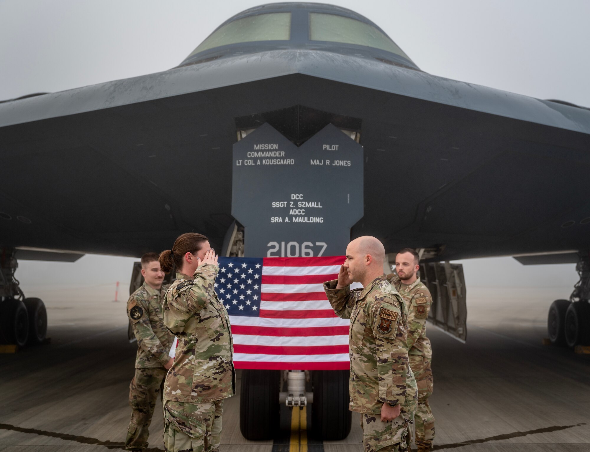 U.S. Air Force Tech. Sgt. Chase Frazee (right), 110th Expeditionary Bomb Squadron, noncommissioned officer in charge of the hydraulics section, salutes Capt. Kaylynn Harms (left), 110th EBS, sortie generation flight commander  after being reenlisted into the USAF at Royal Australian Air Force Base Amberley, Australia, Aug. 23, 2024. Airmen may request any commissioned officer, including Commissioned warrant officers in the grade of CW2, CW3 and CW4, regardless of component in the U.S. Armed Forces to perform their ceremony. (U.S. Air Force photo by Master Sgt. Kenneth W. Norman)