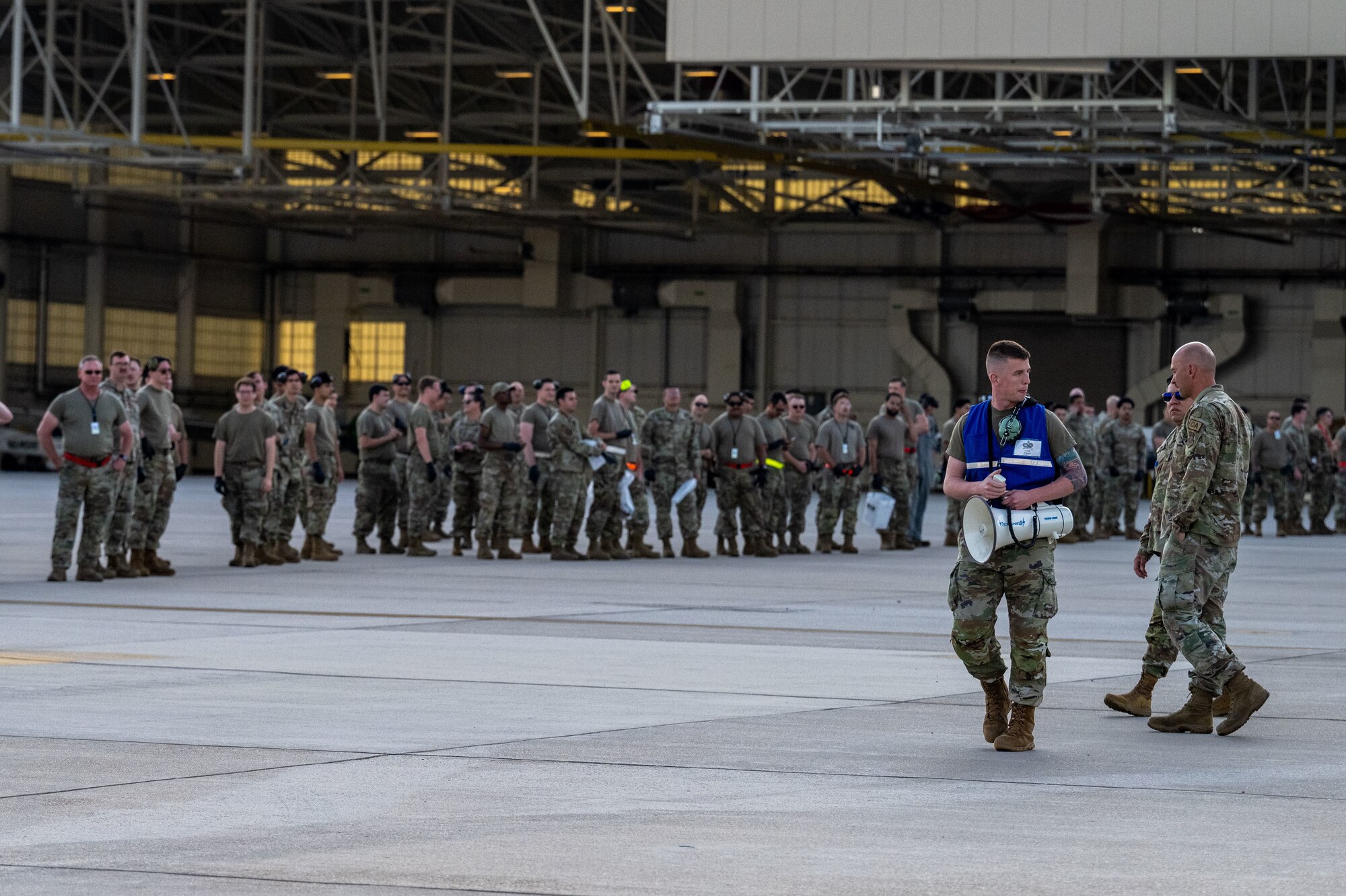Team McConnell Airmen conduct a foreign object debris (FOD) walk following the Frontiers in Flight Air Show Aug. 26, 2024, at McConnell Air Force Base, Kansas. FOD included materials such as rocks, loose hardware, and litter from the air show. (U.S. Air Force photo by Airman 1st Class Paula Arce)