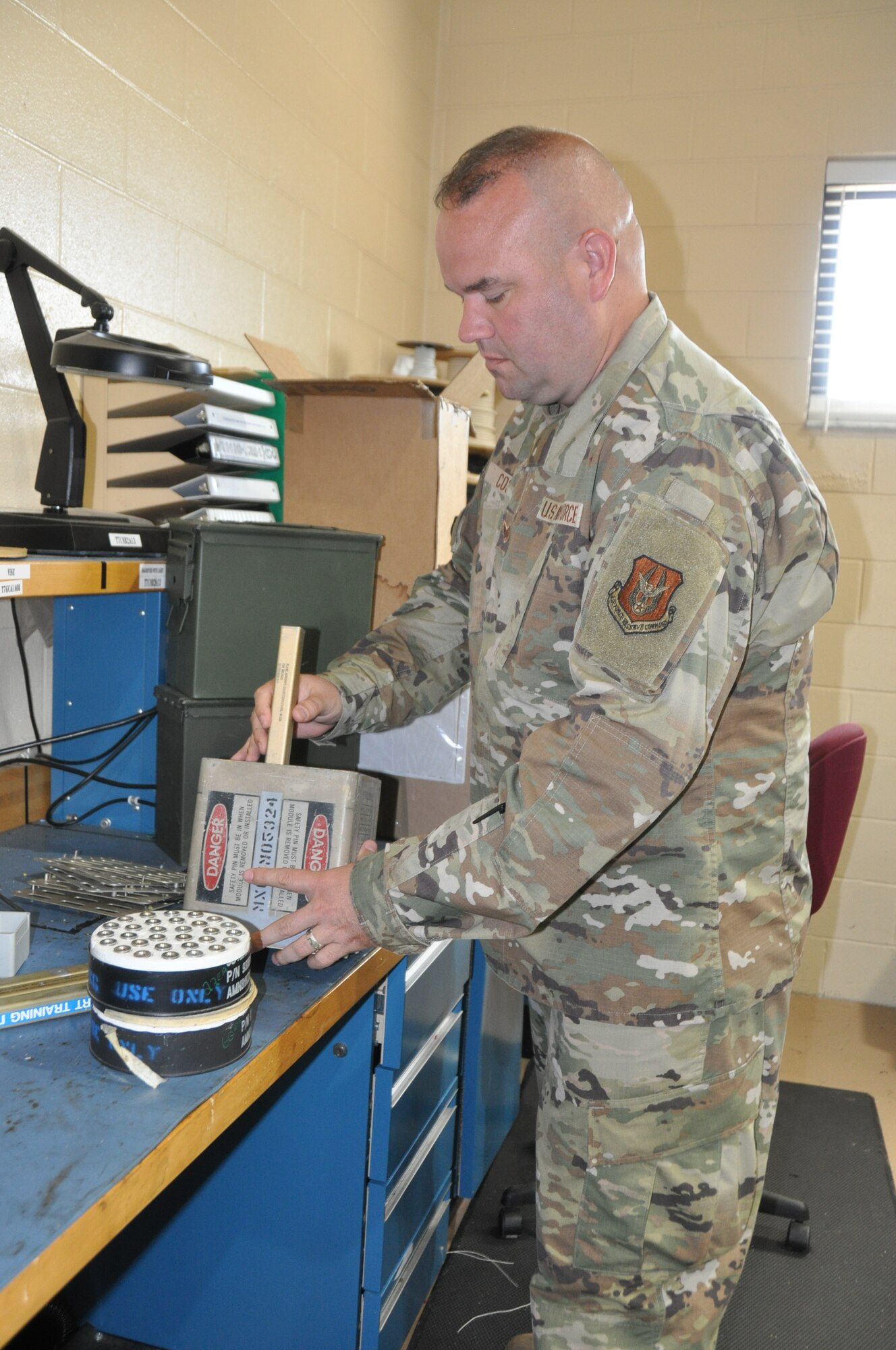 a man works on ammo