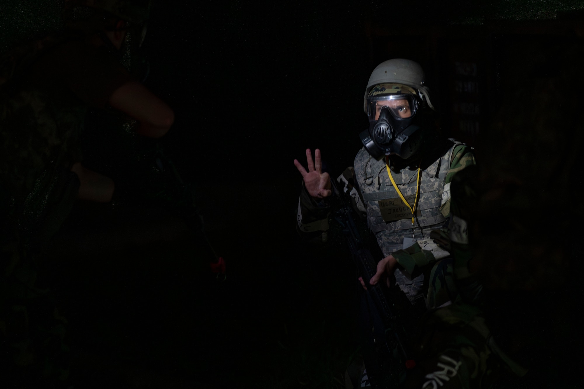 A U.S. Air Force member assigned to the 51st Fighter Wing provides a countersign during a tactical “bug out” movement as a part of Ulchi Freedom Shield 24 at Osan Air Base, Republic of Korea, Aug. 22, 2024. USF24 is an annual exercise that aims to enhance the combined, joint, multi-domain, and interagency operating environment, thereby strengthening the alliance’s response capabilities. (U.S. Air Force photo by Staff Sgt. Ashley N. Mikaio)