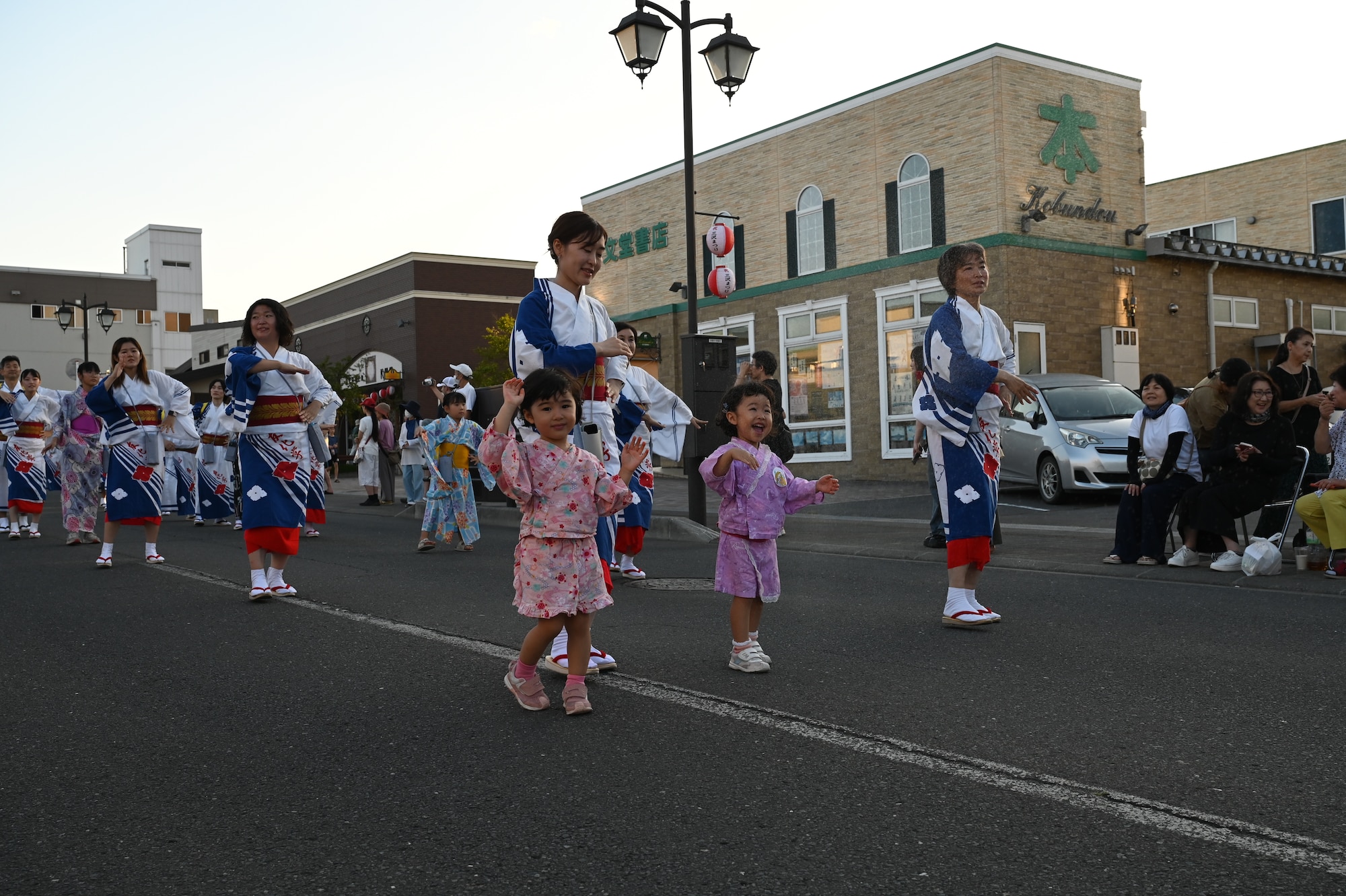 Parade participants dance to the Misawa Yoitoko-Ondo song during the Misawa City Festival at Misawa City.