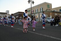 Parade participants dance to the Misawa Yoitoko-Ondo song during the Misawa City Festival at Misawa City.