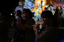 Participants of the Misawa City Festival play flutes to the accompanied of drums and chants at Misawa City