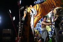 A participant plays taiko drums during Misawa City Festival at Misawa City