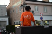 A boy wears a Misawa City Festival 100th anniversary T-shirt at Misawa City