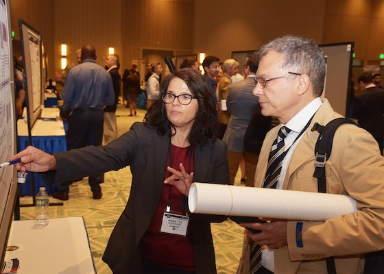 KISSIMMEE, Fla. – (Aug. 27, 2024) – Dr. Annette Rodriguez, of San Antonio, a research scientist, assigned to the Combat Casualty Care and Operational Medicine Directorate, Naval Medical Research Unit (NAMRU) San Antonio, presented research titled, “Effects of Photobiomodulation in an Ex Vivo Model of Laser-Induced Ocular Damage” during Poster Session One on day two of the 2024 Military Health System Research Symposium (MHSRS) held at the Gaylord Palms Resort and Convention Center. The MHSRS brings together military, government, academia, and industry experts for four days of critical conversations and intensive idea sharing. Presenters will share their latest research findings and challenges on topics including combat casualty care, military operational medicine, clinical and rehabilitative medicine, medical simulation and information sciences, military infectious diseases, and the radiation health effects. NAMRU San Antonio is one of the leading research and development laboratories for the U.S. Navy under the Department of Defense (DoD) and is one of eight subordinate research commands in the global network of laboratories operating under the Naval Medical Research Command in Silver Spring, Md.  Its mission is to conduct gap driven combat casualty care, craniofacial, and directed energy research to improve survival, operational readiness, and safety of DoD personnel engaged in routine and expeditionary operations. (U.S. Navy photo by Burrell Parmer, NAMRU San Antonio Public Affairs/Released)