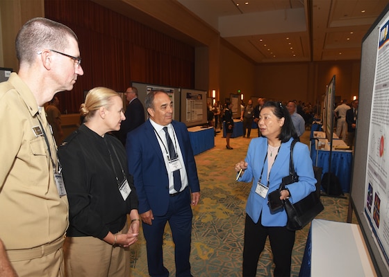 KISSIMMEE, Fla. – (Aug. 27, 2024) – Dr. Heuy-Ching Hetty Wang, of San Antonio, director of Combat Casualty Care and Operational Medicine, Naval Medical Research Unit (NAMRU) San Antonio presented research titled “Computer-Assisted Detection of Retinal Tears Using Machine Learning Algorithms” to NAMRU San Antonio leadership during Poster Session One on day two of the 2024 Military Health System Research Symposium (MHSRS) held at the Gaylord Palms Resort and Convention Center. The MHSRS brings together military, government, academia, and industry experts for four days of critical conversations and intensive idea sharing. Presenters will share their latest research findings and challenges on topics including combat casualty care, military operational medicine, clinical and rehabilitative medicine, medical simulation and information sciences, military infectious diseases, and the radiation health effects. NAMRU San Antonio is one of the leading research and development laboratories for the U.S. Navy under the Department of Defense (DoD) and is one of eight subordinate research commands in the global network of laboratories operating under the Naval Medical Research Command in Silver Spring, Md.  Its mission is to conduct gap driven combat casualty care, craniofacial, and directed energy research to improve survival, operational readiness, and safety of DoD personnel engaged in routine and expeditionary operations. (U.S. Navy photo by Burrell Parmer, NAMRU San Antonio Public Affairs/Released)