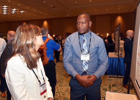 KISSIMMEE, Fla. – (Aug. 27, 2024) – Dr. Dickson Kirui, a research scientist, assigned to the Directed Energy Health Effects Directorate, Naval Medical Research Unit (NAMRU) San Antonio, presented research titled “Investigation of Effects From Suprathreshold Near-Infrared Laser Exposures to Skin on Anatomical and Physiological Parameters” during Poster Session One on day two of the 2024 Military Health System Research Symposium (MHSRS) held at the Gaylord Palms Resort and Convention Center. The MHSRS brings together military, government, academia, and industry experts for four days of critical conversations and intensive idea sharing. Presenters will share their latest research findings and challenges on topics including combat casualty care, military operational medicine, clinical and rehabilitative medicine, medical simulation and information sciences, military infectious diseases, and the radiation health effects. NAMRU San Antonio is one of the leading research and development laboratories for the U.S. Navy under the Department of Defense (DoD) and is one of eight subordinate research commands in the global network of laboratories operating under the Naval Medical Research Command in Silver Spring, Md.  Its mission is to conduct gap driven combat casualty care, craniofacial, and directed energy research to improve survival, operational readiness, and safety of DoD personnel engaged in routine and expeditionary operations. (U.S. Navy photo by Burrell Parmer, NAMRU San Antonio Public Affairs/Released)