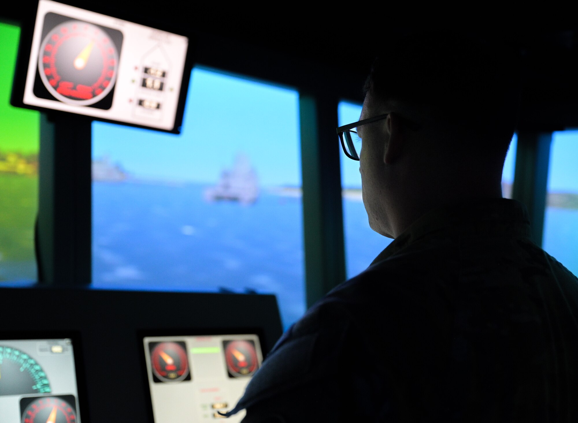 Soldier operating a ship simulator