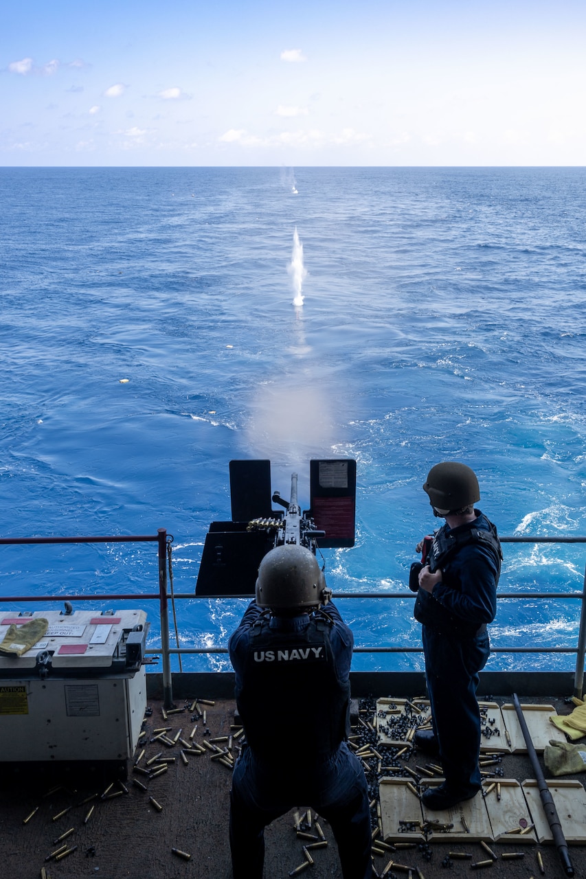 Sailors assigned to weapons department conduct a .50 caliber machine gun live-fire exercise on the fantail aboard the Nimitz-class aircraft carrier USS Harry S. Truman (CVN 75), Aug. 19.