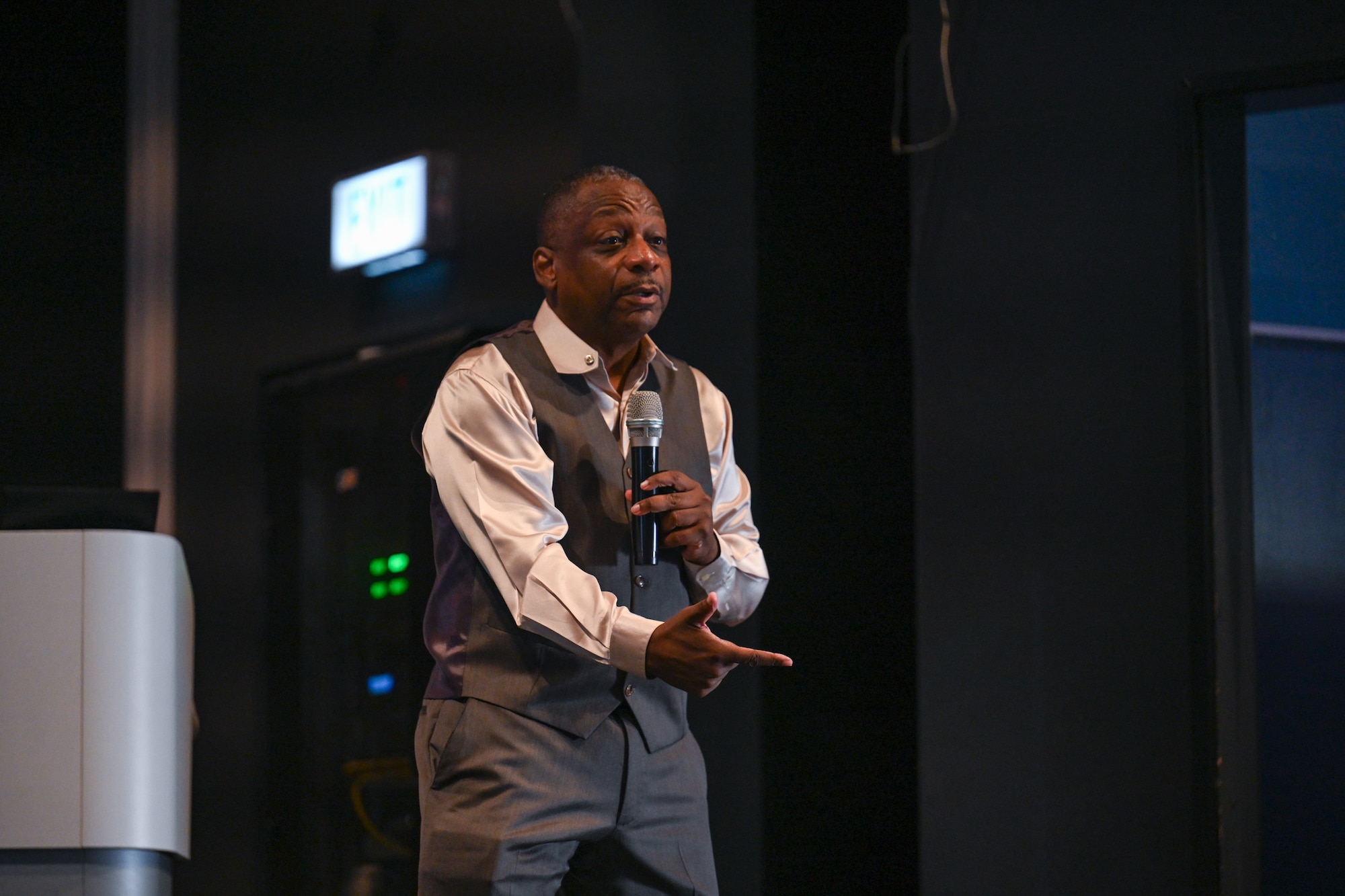 Retired U.S. Air Force Chief Master Sgt. Anthony Brinkley teaches Airmen assigned to the 521st Air Mobility Operations Wing about the composition of healthy teams a Warrior Heart keynote speech, August 29, 2024, at the Herc Theater on Ramstein Air Base, Germany.