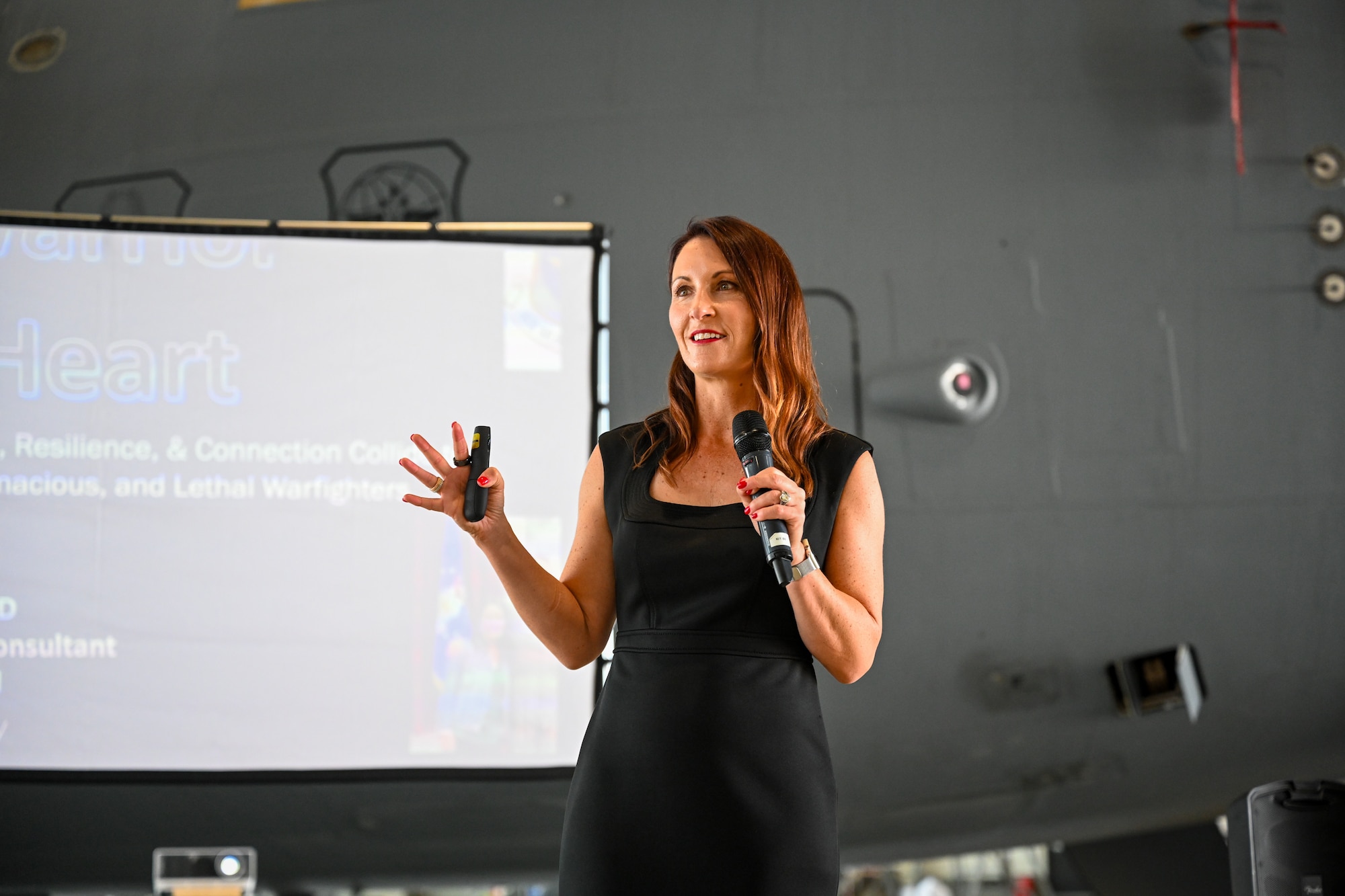 Dr. Jannell MacAulay, a strategic health and human performance specialist, gives a Warrior Heart keynote speech to Airmen assigned to the 521st Air Mobility Operations Wing, August 29, 2024, inside of Hangar 5 on Ramstein Air Base, Germany.